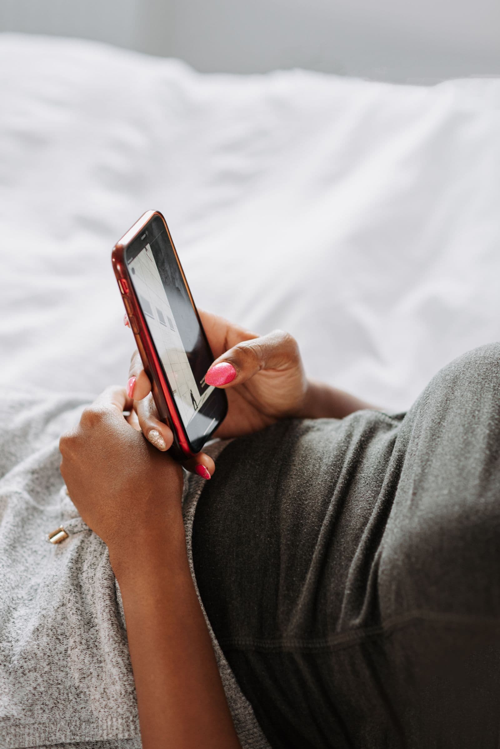 Person reading on their phone, relaxed