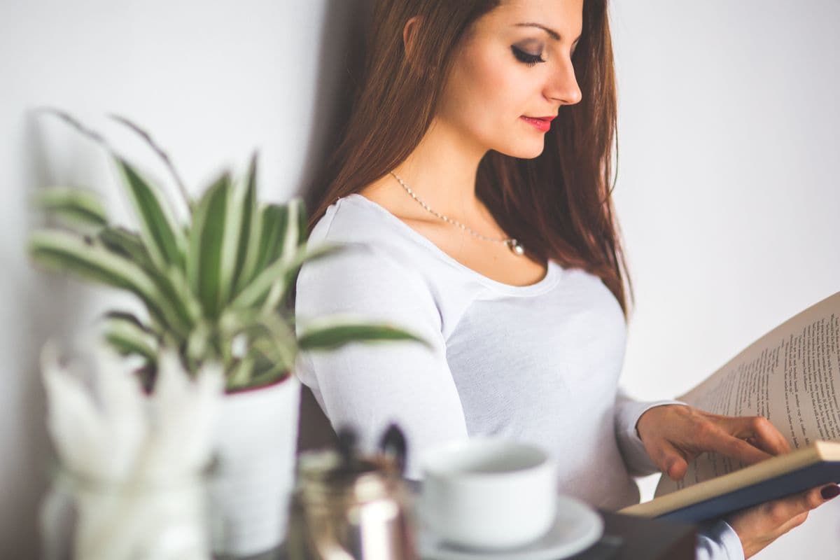 Person enjoying a quiet reading moment at home