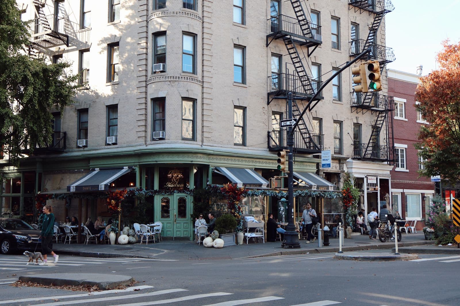 Busy street with a cafe, evoking a new city abroad